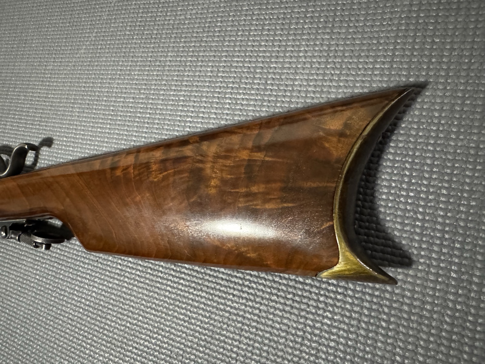 Stevens 44 buttstock showing figured walnut and the crescent rifle buttplate