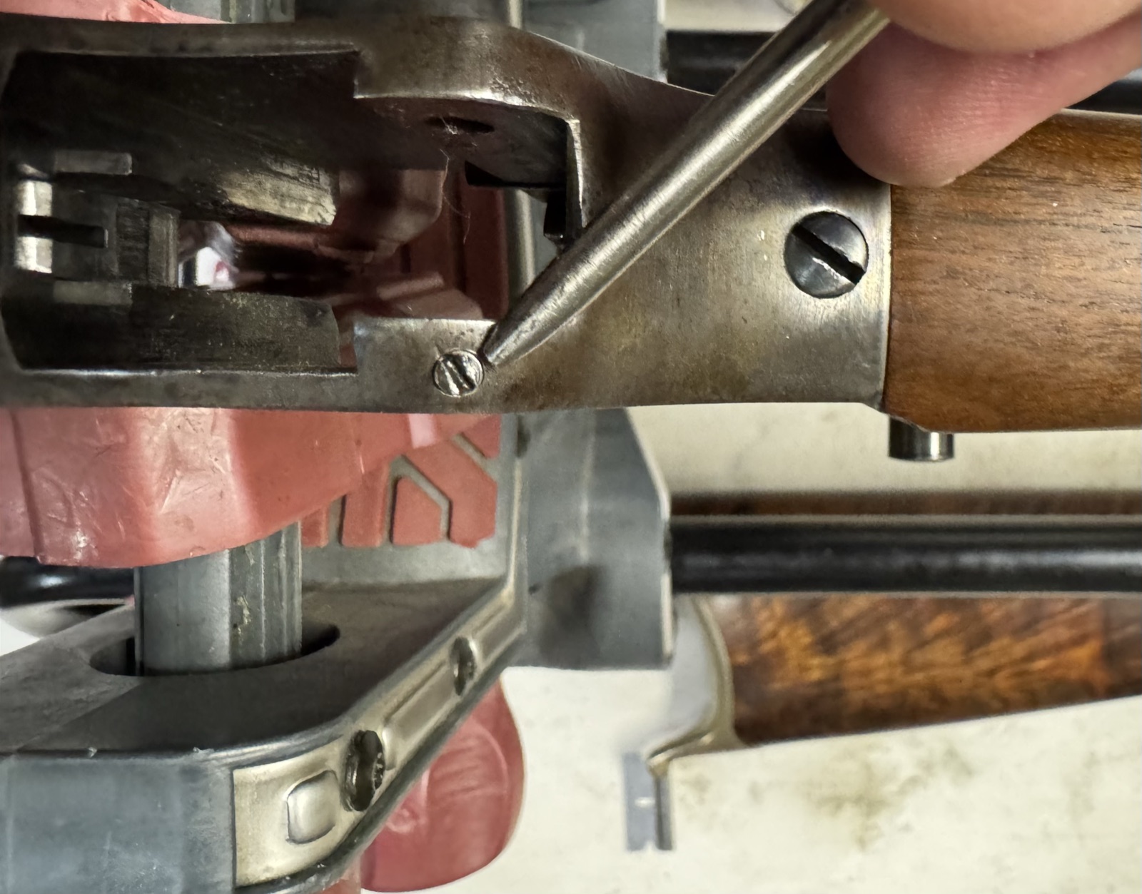 Pointer on the lever pivot pin lock screw at the rear of the Stevens 44½ receiver, action open