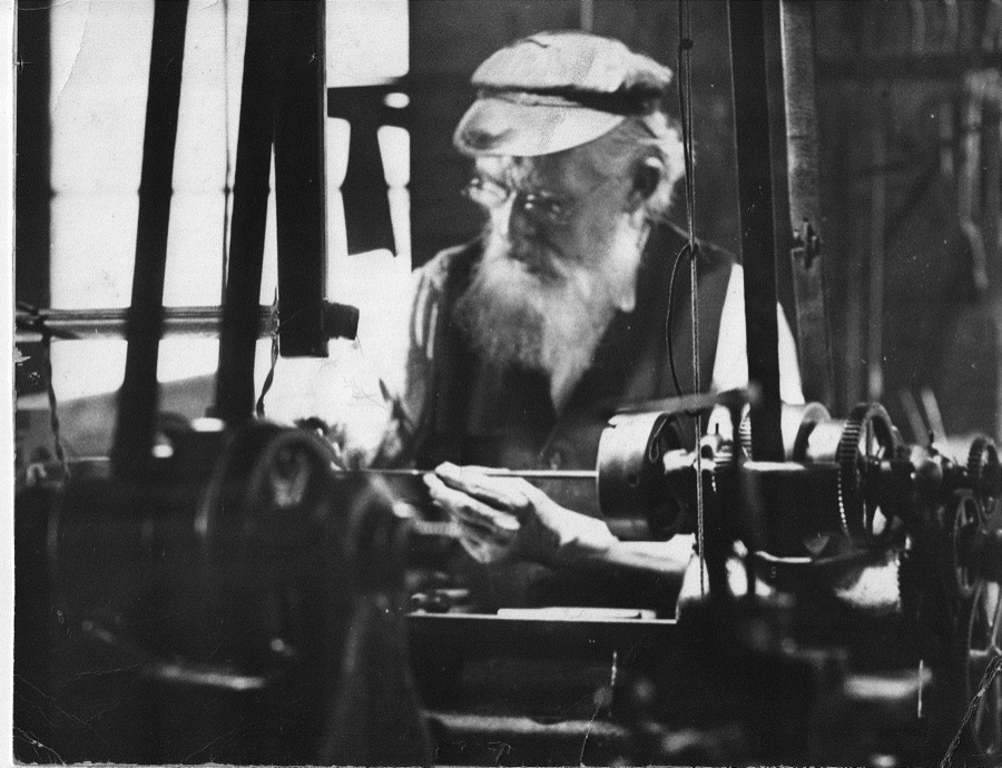 Harry M. Pope at his lathe in his workshop